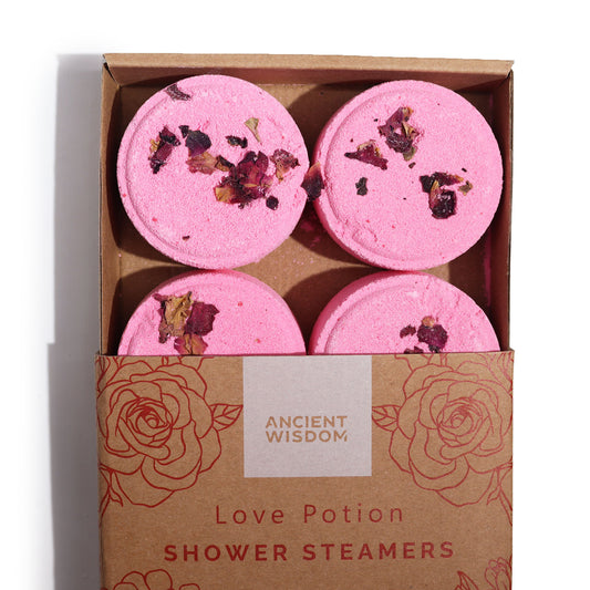 imagen de un paquete vaporizante de ducha posión de amor, con  petalos de rosa natural
